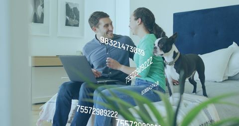 Couple Interacting with Digital Data and Laptop at Home