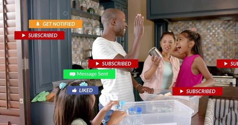 Family high-fiving in kitchen while organizing storage bins with social media alerts