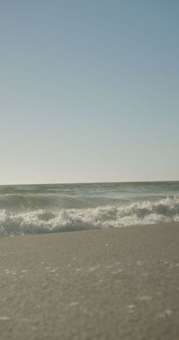 Tranquil Waves on Sunny Beach Horizon - Download Free Stock Images Pikwizard.com