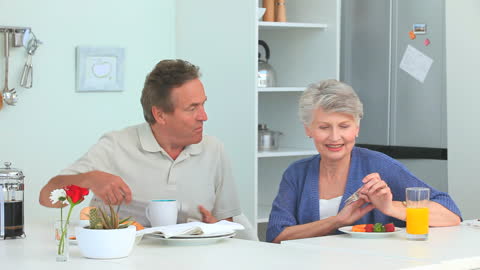 Senior Couple Enjoying Breakfast Together at Home