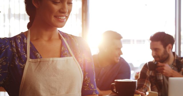 Smiling Barista in Cozy Coffee Shop Serving Coffee - Download Free Stock Images Pikwizard.com