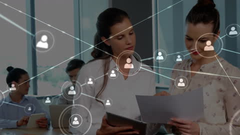 Business Professionals Discussing Documents with Digital Networking