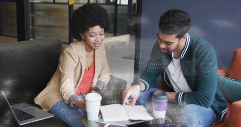 Young Professionals Cooperating on Project Ideas in Creative Workspace