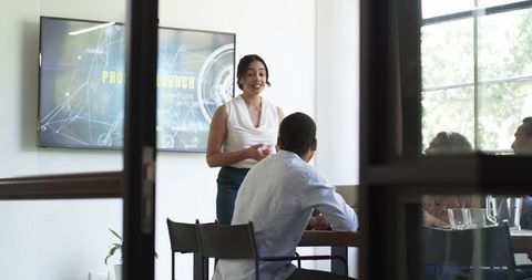 Diverse Team Engaging in an Office Presentation Meeting
