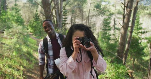 Diverse Couple Enjoying Nature with Photography during Leisure Hike
