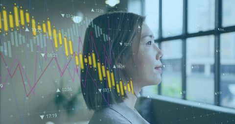 Businesswoman Analyzing Financial Growth with Graphs and Data