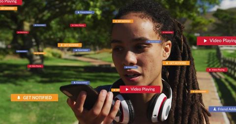 Dreadlocked Woman Using Smartphone in Park Surrounded by Alerts