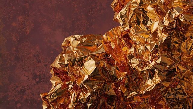 Abstract gold crumpled foil with reflective textures