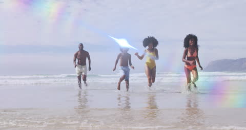 Family Enjoying Day at Beach with Vibrant Light Trails