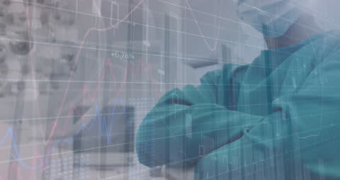 Doctor Analyzing Financial Data in Modern HealthTech Environment