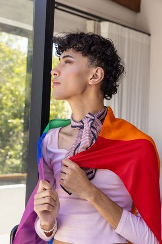 Expressive Male Holding Rainbow Flag, Embracing LGBTQ Pride