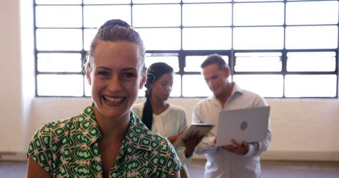 Smiling businesswoman in modern casual workspace