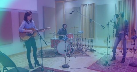 Musicians performing in professional recording studio