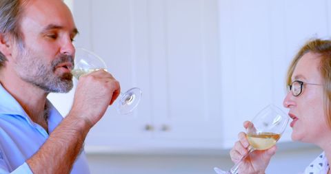 Couple Enjoying Wine Tasting at Home in Relaxed Atmosphere - Download Free Stock Images Pikwizard.com
