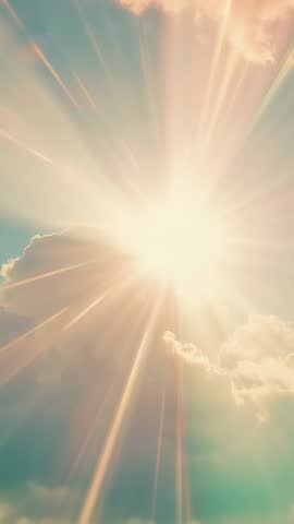 Vertical Sunburst Breaking Through Clouds with Warm Lens Flare and Radiant Rays for Video Background