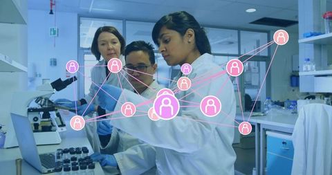 Scientists collaborating in laboratory with network graphics