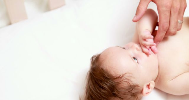 Father's Hand Comforting Newborn Baby in Crib - Download Free Stock Images Pikwizard.com