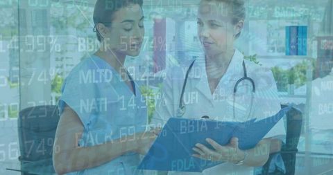 Medical professionals analyzing patient information in modern office