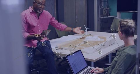 Diverse Professionals Analyzing Business Data with Digital Overlay