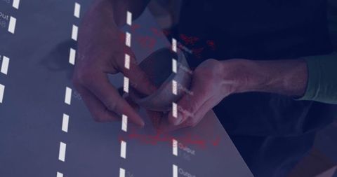 Hands with smartphone projecting code on ambient surface