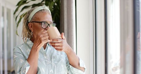 Senior African American Woman Viewing Scenic Landscape with Coffee - Download Free Stock Images Pikwizard.com