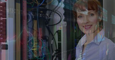 Smiling female it expert monitoring network servers in data center
