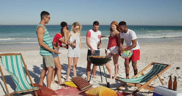 Group of Friends Barbecuing on Sunny Beach - Download Free Stock Images Pikwizard.com