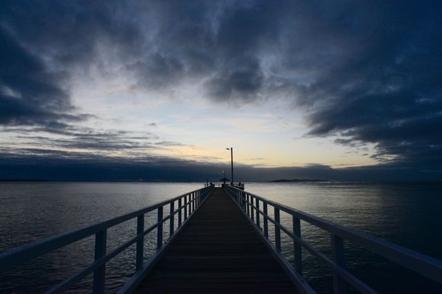 Moody Pier Silhouette at Sunset - Download Free Stock Photos Pikwizard.com