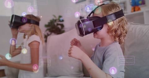 Children playing with vr headsets on sofa with floating augmented reality interface