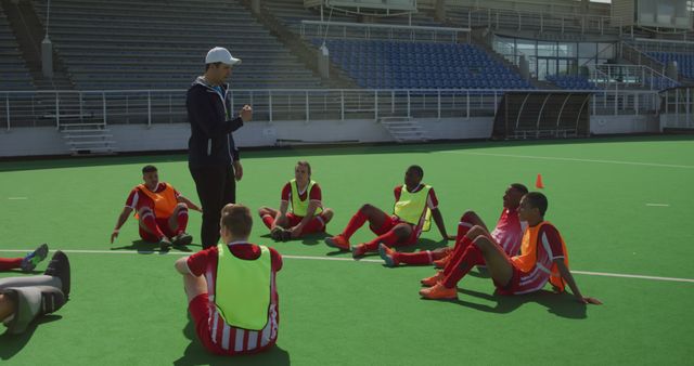 Soccer Coach Giving Team Strategy Talk During Training Session - Download Free Stock Images Pikwizard.com