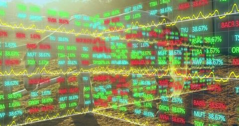 Businesswoman analyzing data panels with stock tickers outdoors at sunrise