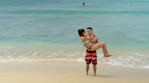 Romantic Couple Embracing on Tranquil Beach