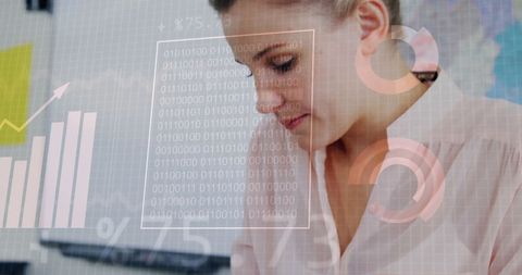 Businesswoman Analyzes Financial Data with Digital Interface