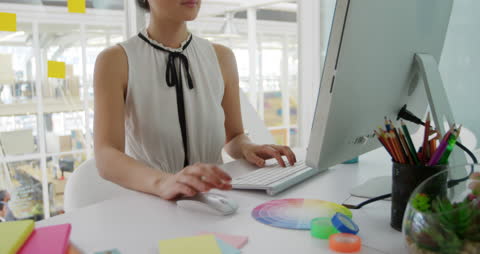 Creative Designer Working on Color Wheel in Modern Office Setting