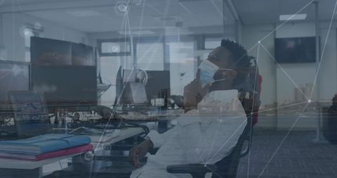 Businessman with face mask in futuristic digital office concept