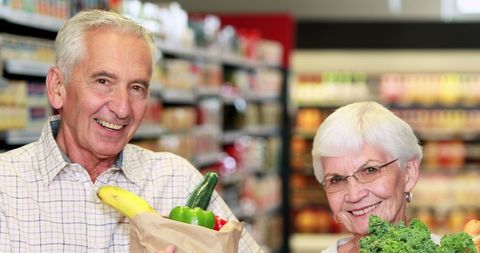 Smiling Senior Couple Shopping for Fresh Groceries