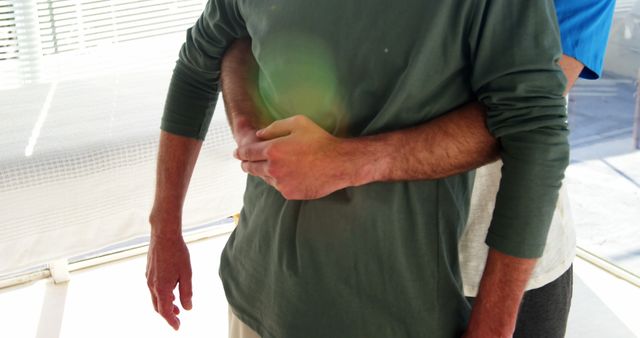 Midsection Of Two Men Hugging With Sunlight Filter - Download Free Stock Images Pikwizard.com