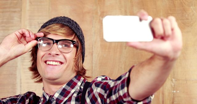 Young Man Taking Selfie in Casual Outfit with Plaid Shirt - Download Free Stock Images Pikwizard.com