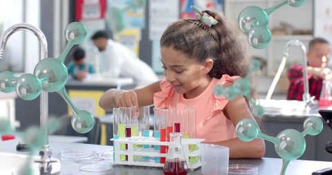 Young Student Conducting Science Experiment in Classroom - Download Free Stock Images Pikwizard.com