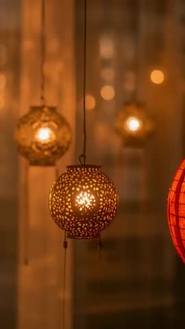 Glowing Metal Lanterns Swaying in Warm Bokeh Ambience | Vertical Shop Display Video
