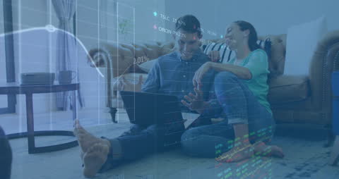 Couple Analyzing Stock Market Data at Home