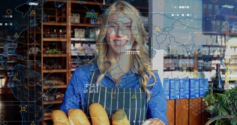 Smiling bakery worker holding baguettes in rustic shop with global digital data overlay