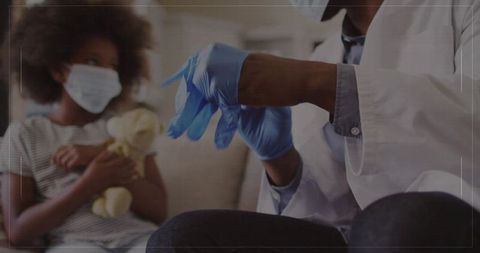 Pediatrician preparing for examination with young patient