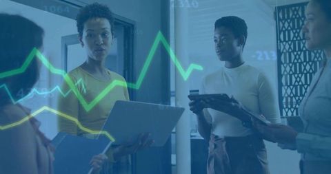 Professionals Analyzing Business Data with Digital Devices in Office