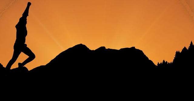 Digital composite of Silhouette businessman with arm raised running on mountains during sunset