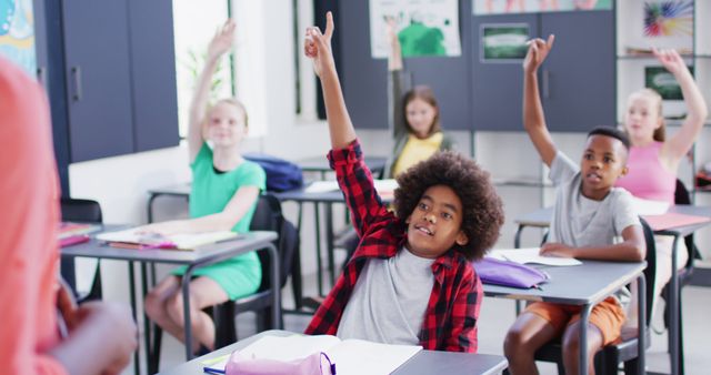 Engaged Diverse Students Raising Hands in a Classroom - Download Free Stock Images Pikwizard.com