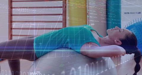 Woman exercising on stability ball with digital fitness data overlay for wellness tech