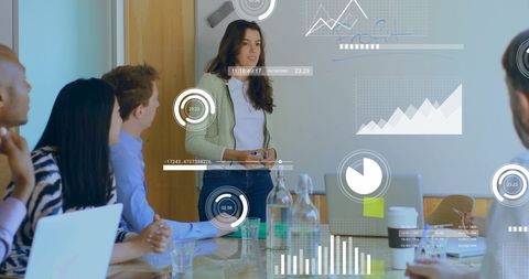 Diverse Team Analyzing Business Analytics in Office Meeting