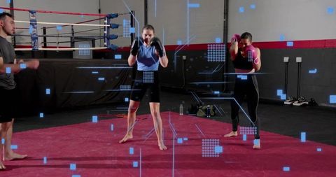 Female boxing training barefoot on red mat with coach near ring, women workout