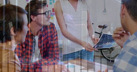 Diverse Team Analyzing Digital Analytics in Modern Office